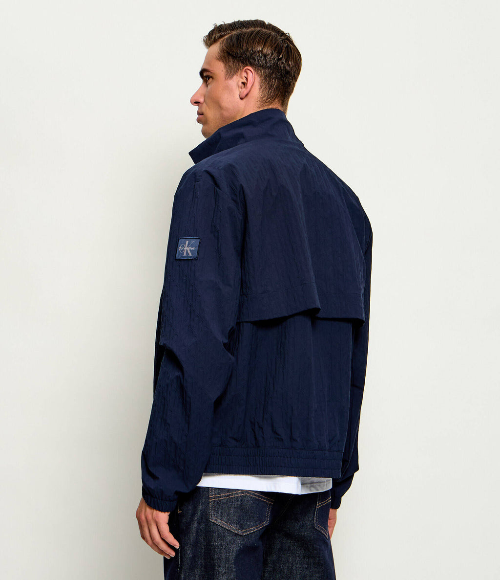 Calvin Klein Jeans | LV04RG512G Repeat Logo Lightweight Windbreaker Funnel Neck Jacket - Dark Navy